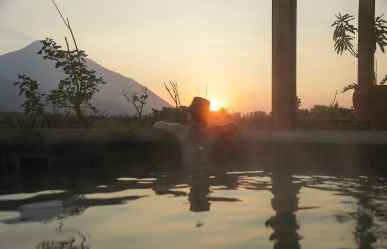 Singita Kwitonda Lodge's Swimming Pool at sunset overlooking Volcanoes National Park - Imagery courtesy of Singita Kwitonda Lodge
