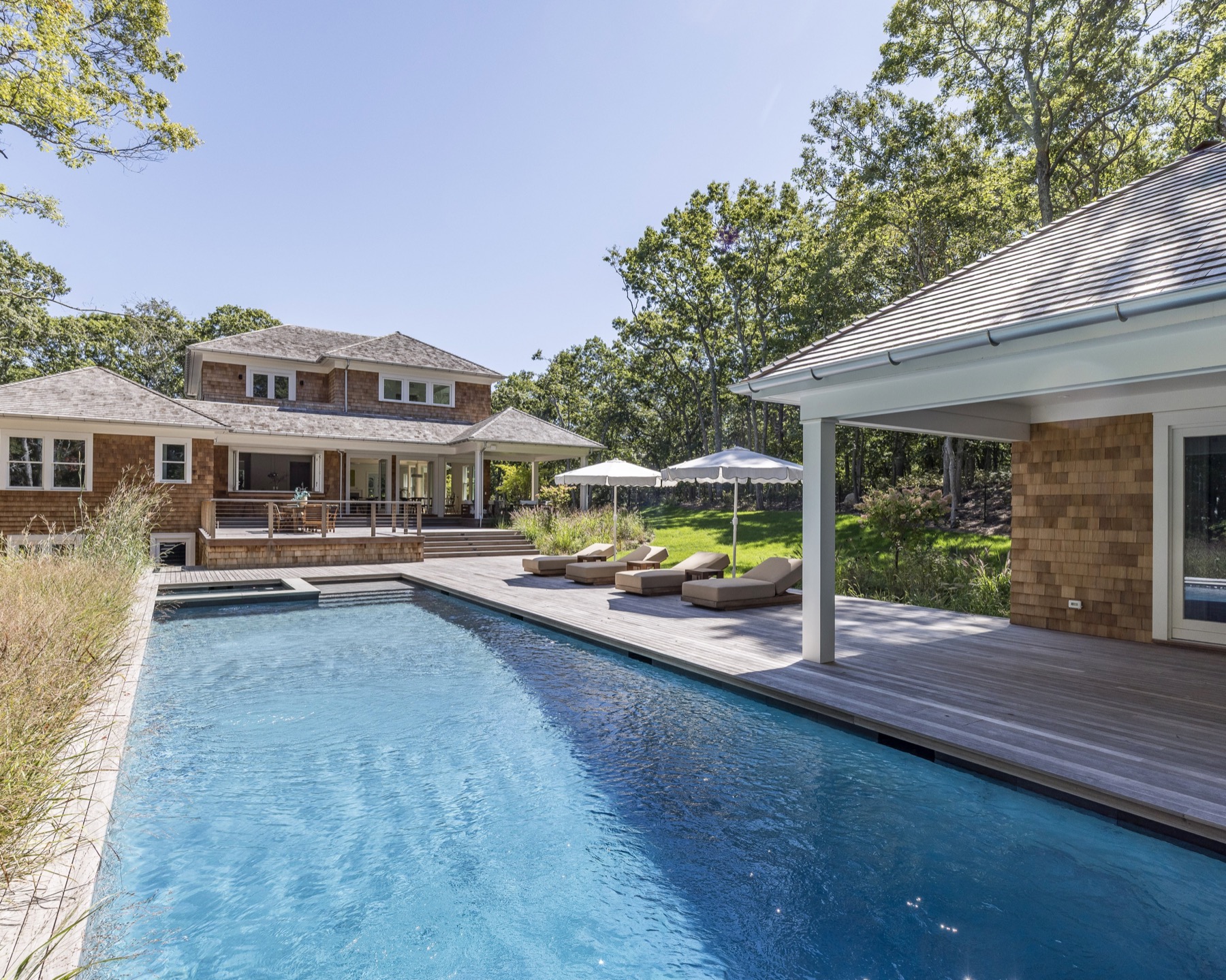 Pool and spa between the main house and pool house
